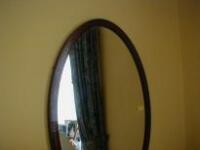 Edwardian cross-banded oval wall mirror