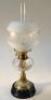 An Edwardian brass and glass oil lamp