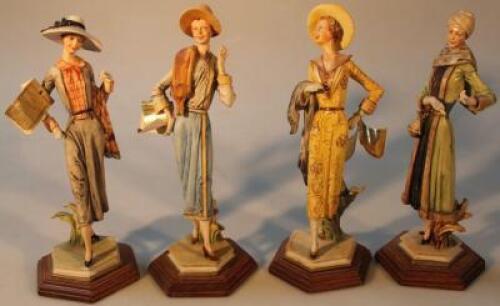 A set of four Capo di Monte figures