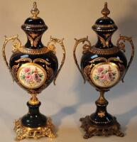 A near matching pair of ormolu style porcelain vases