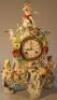 A Meissen clock group