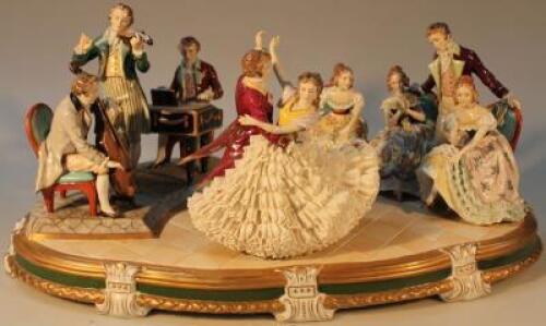 A large Continental porcelain courting couple and musician group