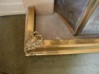 A Victorian brass fender