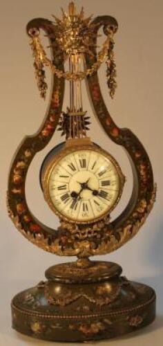 A carved wooden mantel clock