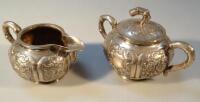 An early 20thC Chinese white metal jug and two handled sugar bowl