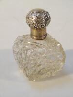 An Edwardian silver and cut glass perfume bottle