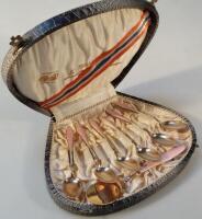 A Continental white metal and gilt enamel cutlery set