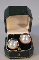 A pair of pearl ear studs