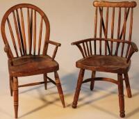 A stained hardwood miniature comb back Windsor chair