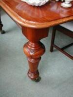 A Victorian mahogany extending dining table