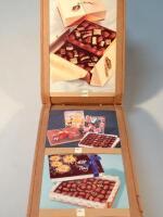 A quantity of Cadbury's chocolate bar wrappers and advertising cards