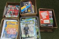 A quantity of football programmes