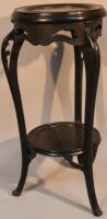 An early 20thC ebonised oak plant stand