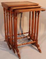 An Edwardian nest of three mahogany tables