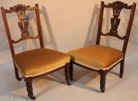 A pair of late Victorian mahogany framed nursing chairs