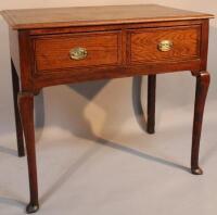 An Edwardian oak lowboy