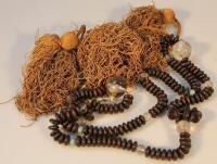 A 19th/early 20thC ethnic wooden bead and glass necklace.