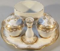 An Edwardian earthenware dressing table set