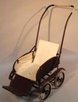 An early 20thC metal framed pram