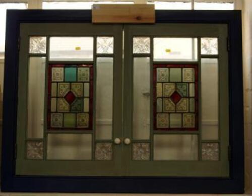 A stained glass twin door panel