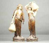 A pair of early 20thC plaster Arabesque figures of ladies with water pitchers