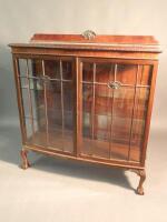 A 1920s mahogany display cabinet