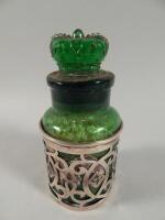 A green moulded Edwardian glass and silver mounted bath salts container