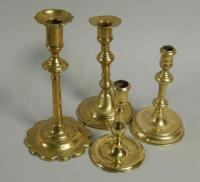 Four various 18th and 19thC brass candlesticks