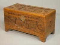 A 20thC carved Oriental camphor wood chest