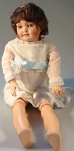 An early 20thC bisque headed doll