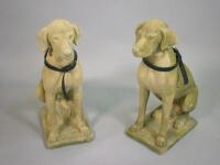 A pair of garden ornaments in the form of hounds