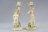 A pair of Royal Worcester Hadley figural candlesticks