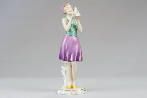 A Royal Dux Art Deco figure of a girl