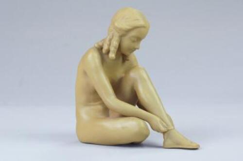 A Goldsheider terracotta model of a seated nude girl