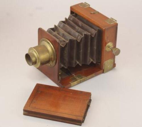 A 19thC quarter plate mahogany and brass camera