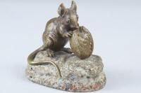 After Clovis-Edmond Masson. A 19thC French bronze sculpture of a mouse gnawing a walnut on a natural