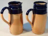 Two similar Royal Doulton stoneware jugs