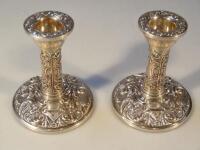 A pair of 20thC silver dwarf candlesticks