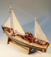 A wooden pond yacht