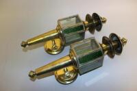 A pair of coaching style brass wall lights