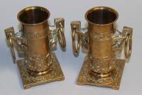 A pair of late 19thC / early 20thC aesthetic style brass two-handled vases