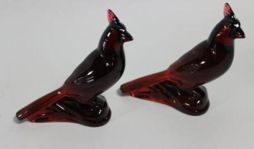 A pair of Baccarat deep red glass parakeets