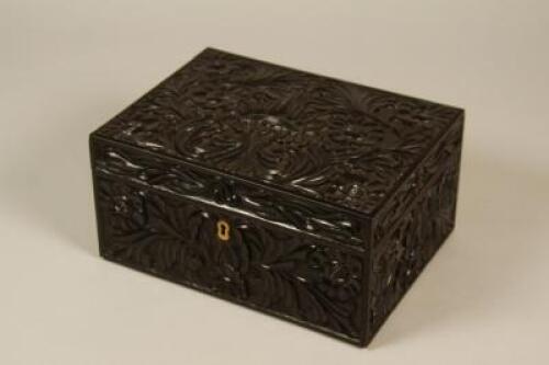 A 19thC Anglo Indian carved ebony workbox