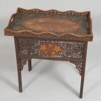 A late 19th/early 20thC Middle Eastern hardwood and brass inlaid rectangular tray table