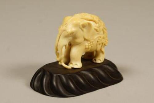 A late 19th/early 20thC carved Indian figure of an elephant