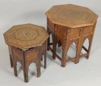 Two similar Middle Eastern hardwood brass and ebony inlaid octagonal tables