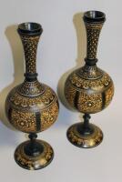 A pair of Eastern ebonised and incised vases or candlesticks