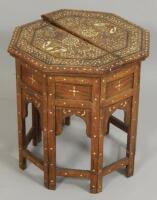 An early 20thC Middle Eastern hardwood ebony and ivory inlaid octagonal table