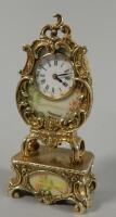 A Continental gilt white metal miniature mantel timepiece