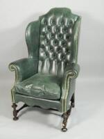 An oak wing back armchair